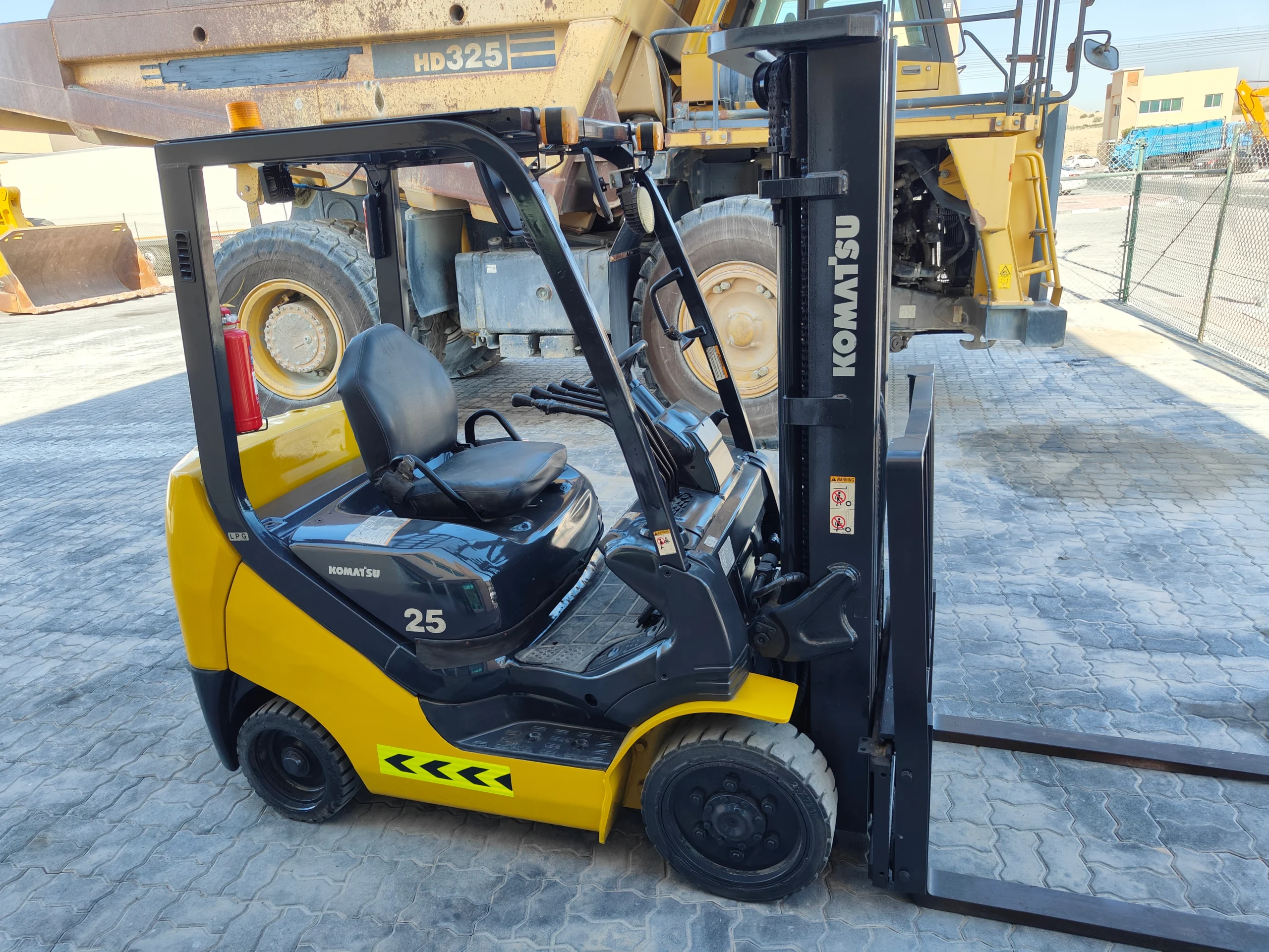 Excavator digging trench on building site