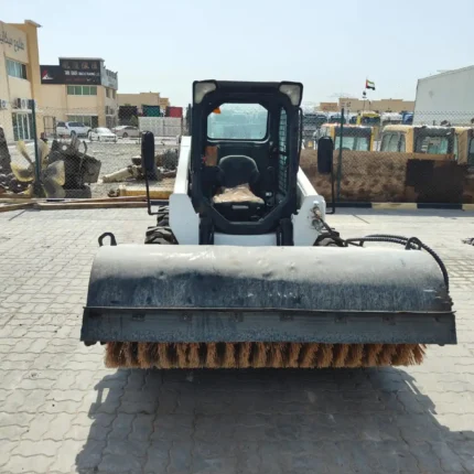Shovel loader clearing construction debris