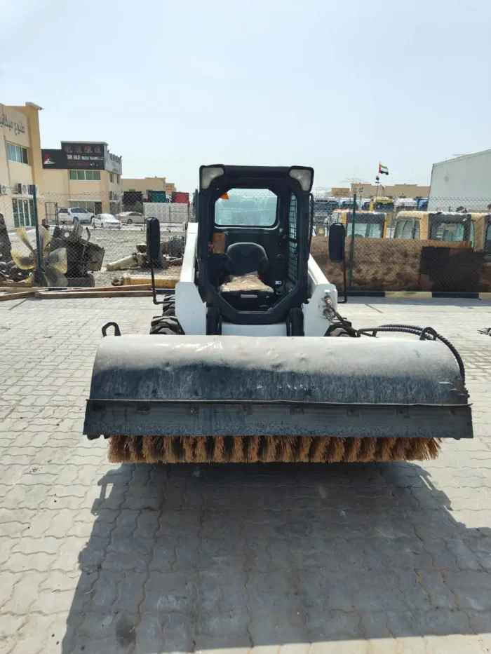 Shovel loader clearing construction debris